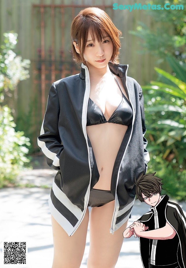 A woman in a black bikini and a black jacket.