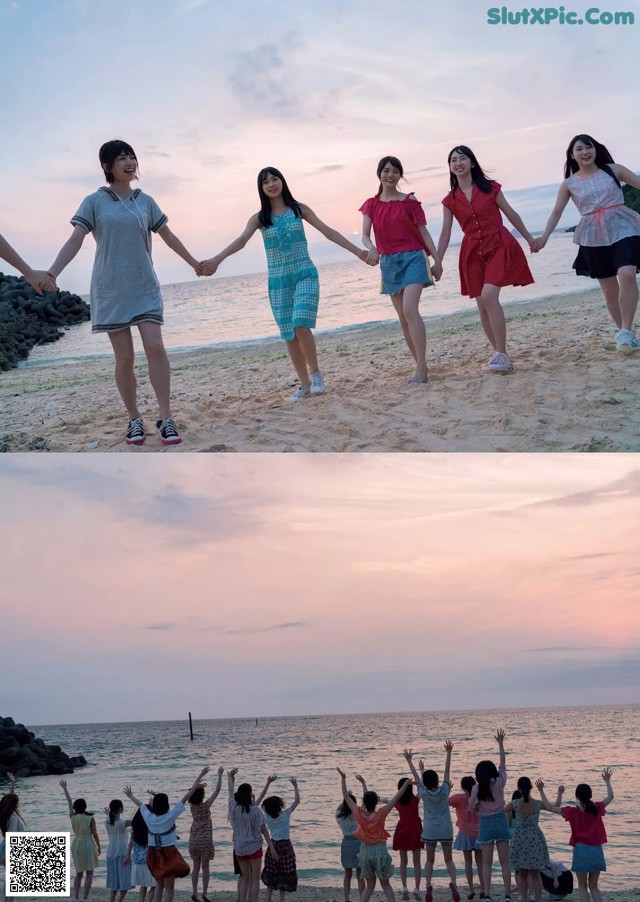 A group of young women holding hands on a beach.