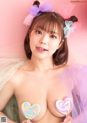 A woman in a white lingerie with a bow tie.