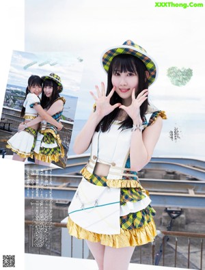 A woman in a yellow and white dress and hat posing for a magazine.